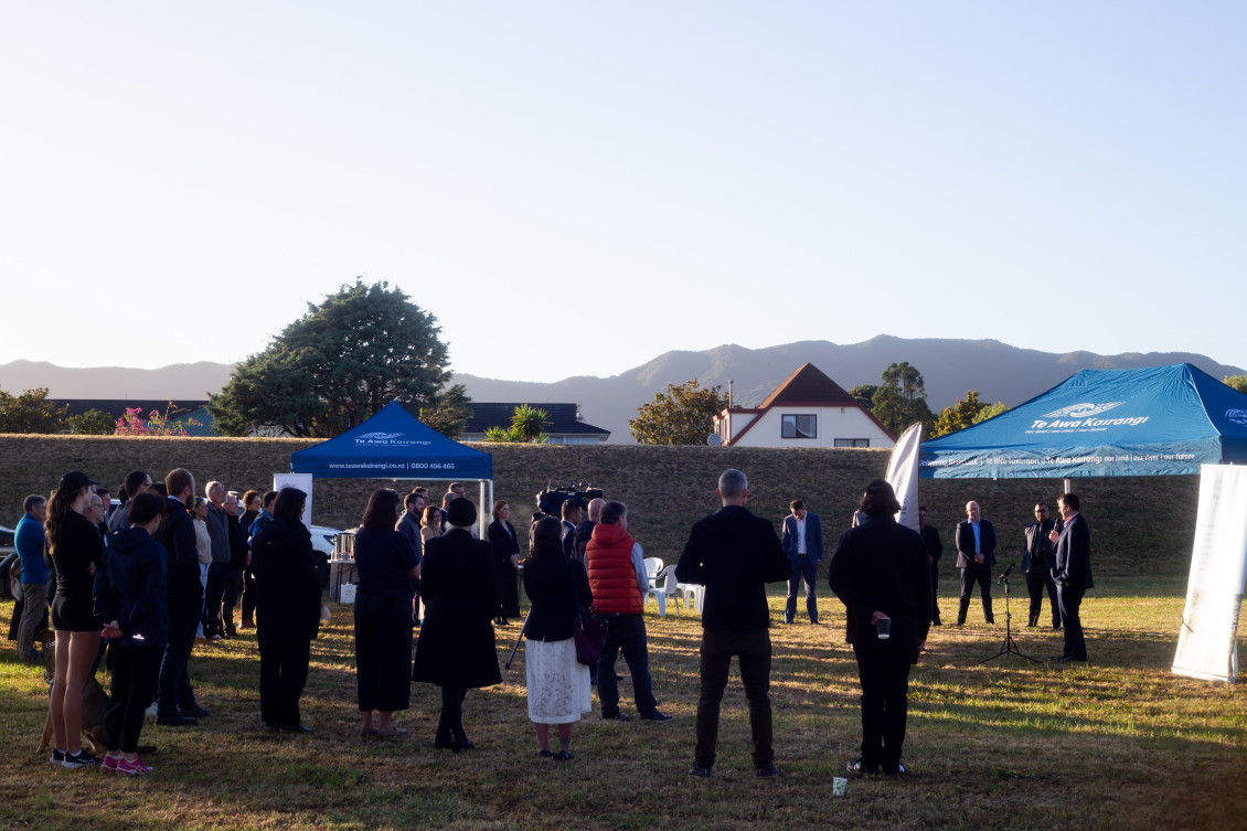 Wide shot of the crowd at the sod turning event