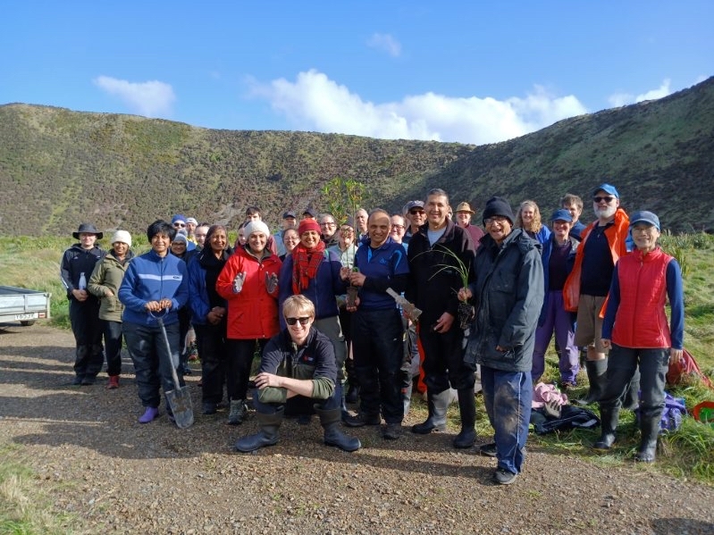 A crowd of volunteers at the Ōrua-pouanui/Baring Head planting day
