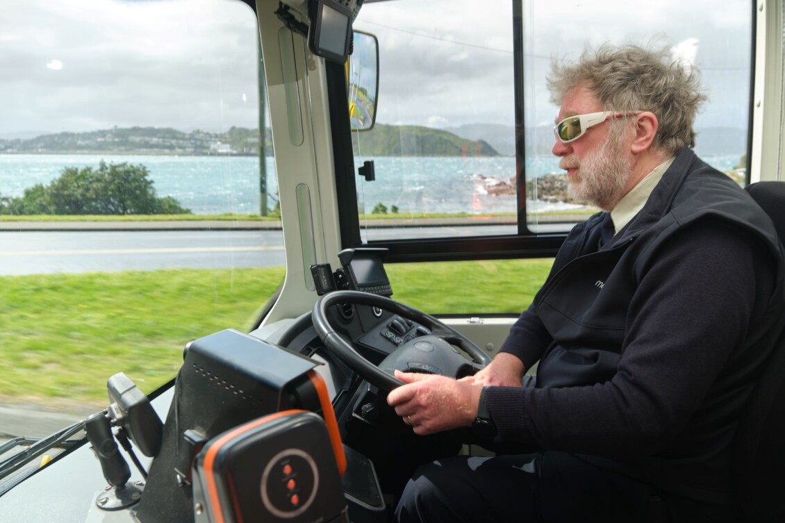 Metlink bus driver Peter, driving around a bay with the window open