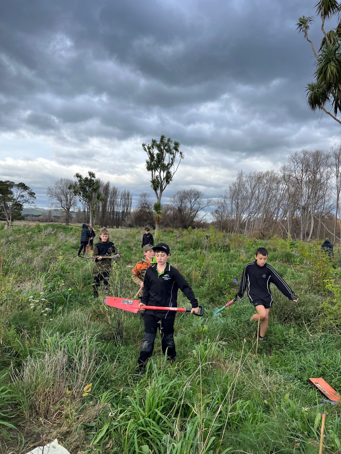 School children planting at Ruamāhanga Farm