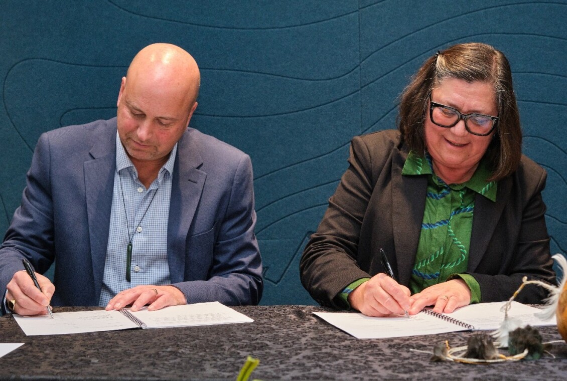 Atiawa ki Whakarongotai Charitable Trust Chief Executive Richard Evans and Chair Helena Gerretzen Parata sign Mana Whakahono ā Rohe agreements.