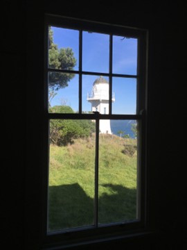 A view from one of the Assistant Lightkeepers cottage bedrooms. Showing Lighthouse and sea in background. 