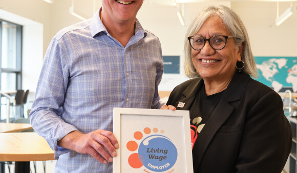 Chief executive Nigel Corry and Living Wage Aotearoa national chair Muriel Tunoho holding the certificate of accreditation